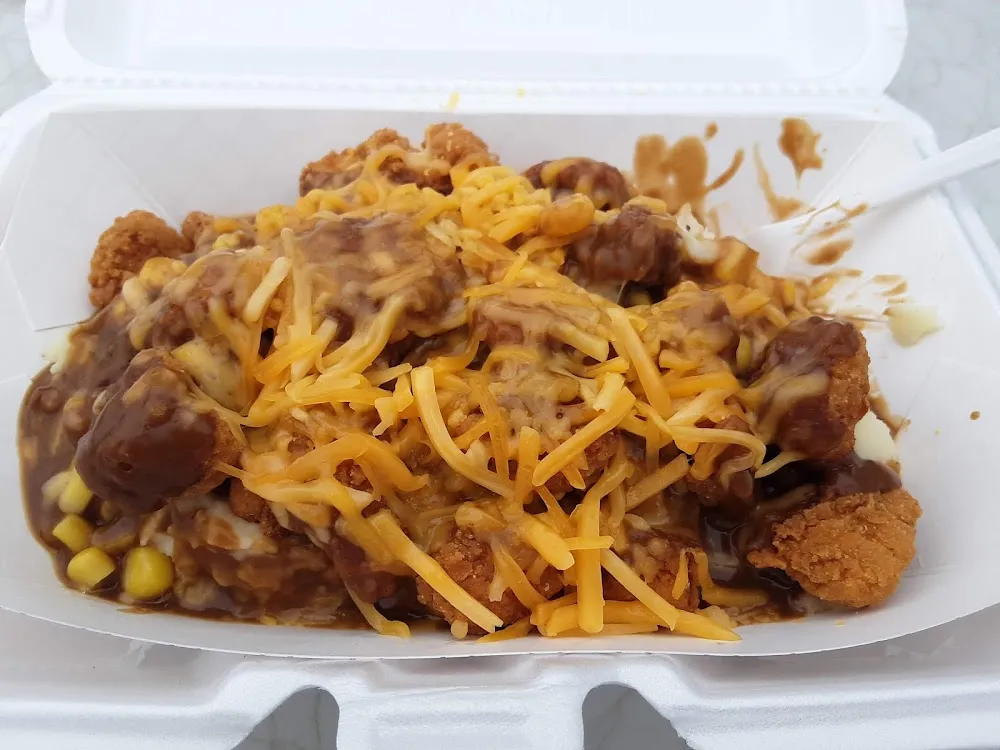 Daily Special Fried Chicken on Mash Potatoes w Corn a Ton of Gravy &Cheese